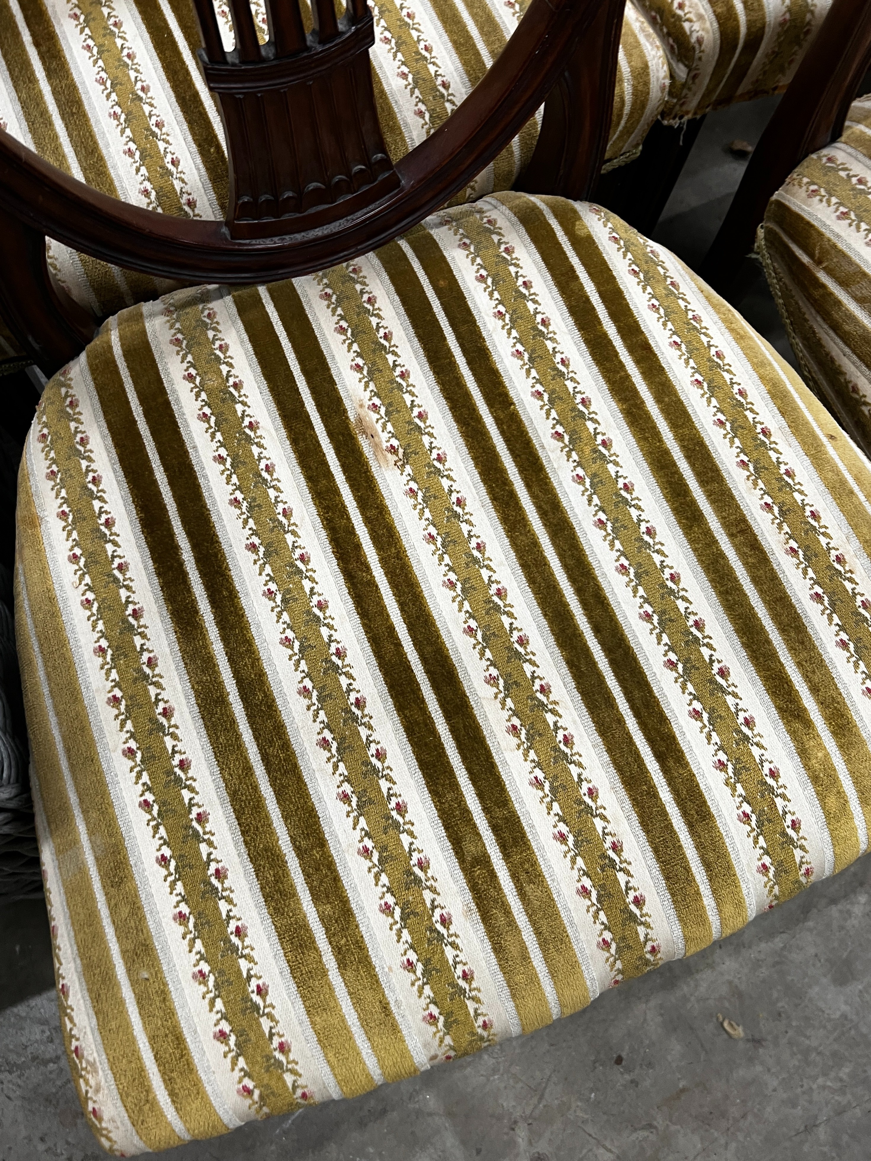 A set of eight early 20th century mahogany Hepplewhite style shield back dining chairs, two with arms